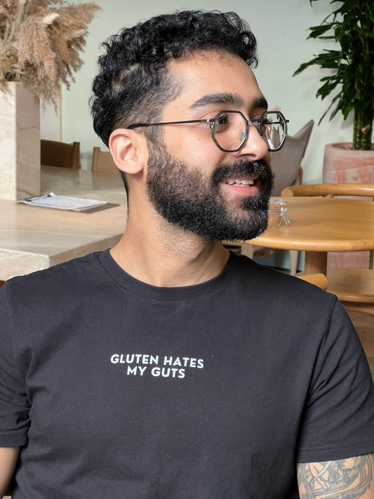 "Gluten Hates My Guts" - Unisex 100% Organic Cotton T-shirt | Black with White Text | For Men and Women