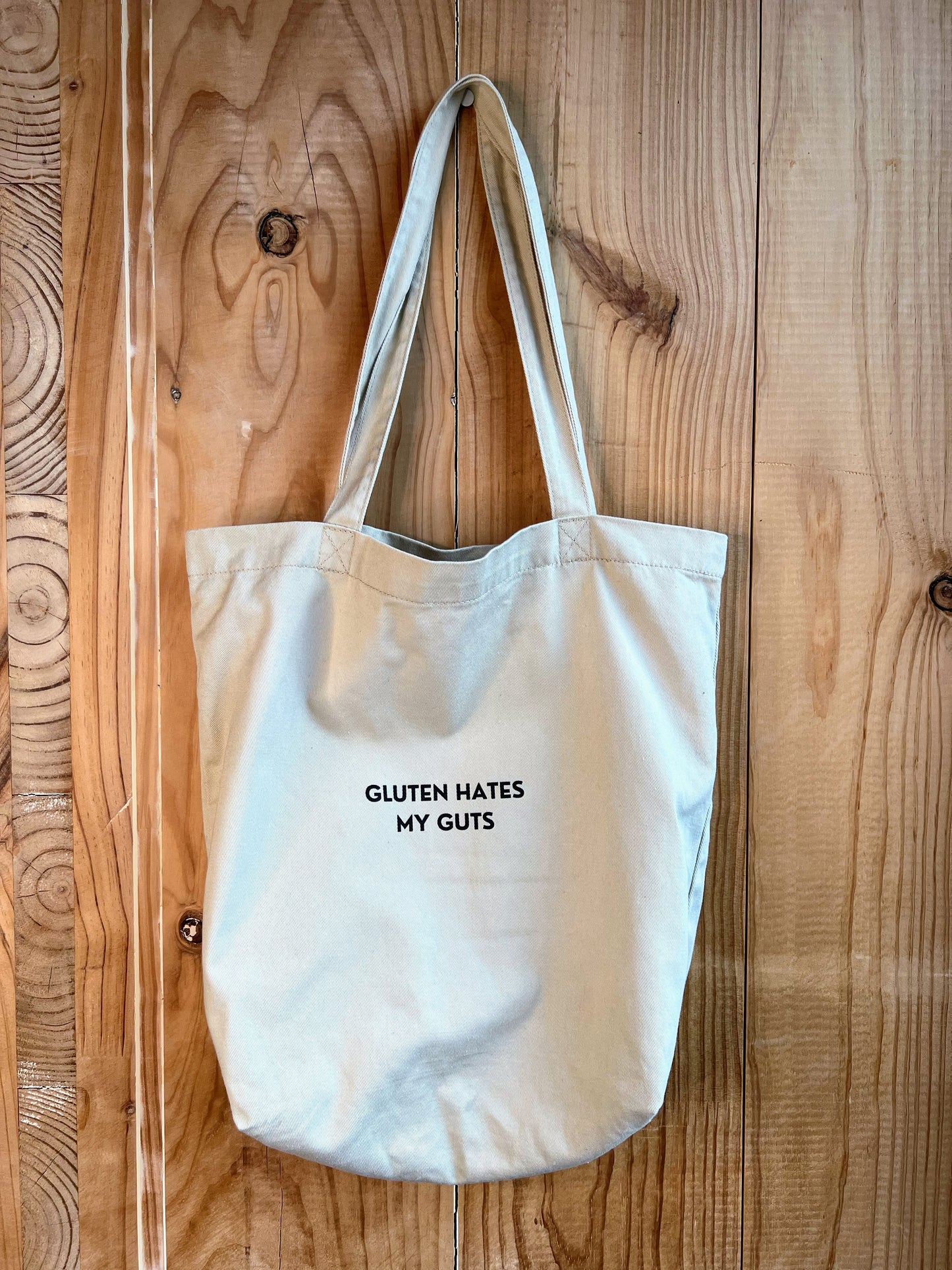 "Gluten Hates My Guts" - 8oz Eco Tote Bag | 100% Organic cotton | Beige with black text