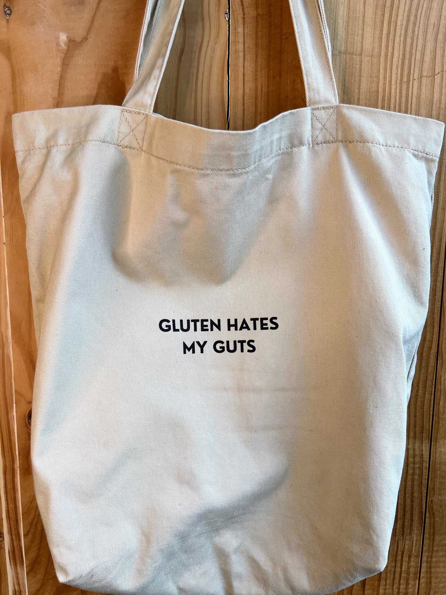 "Gluten Hates My Guts" - 8oz Eco Tote Bag | 100% Organic cotton | Beige with black text